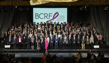 group of people in formalwear on stage